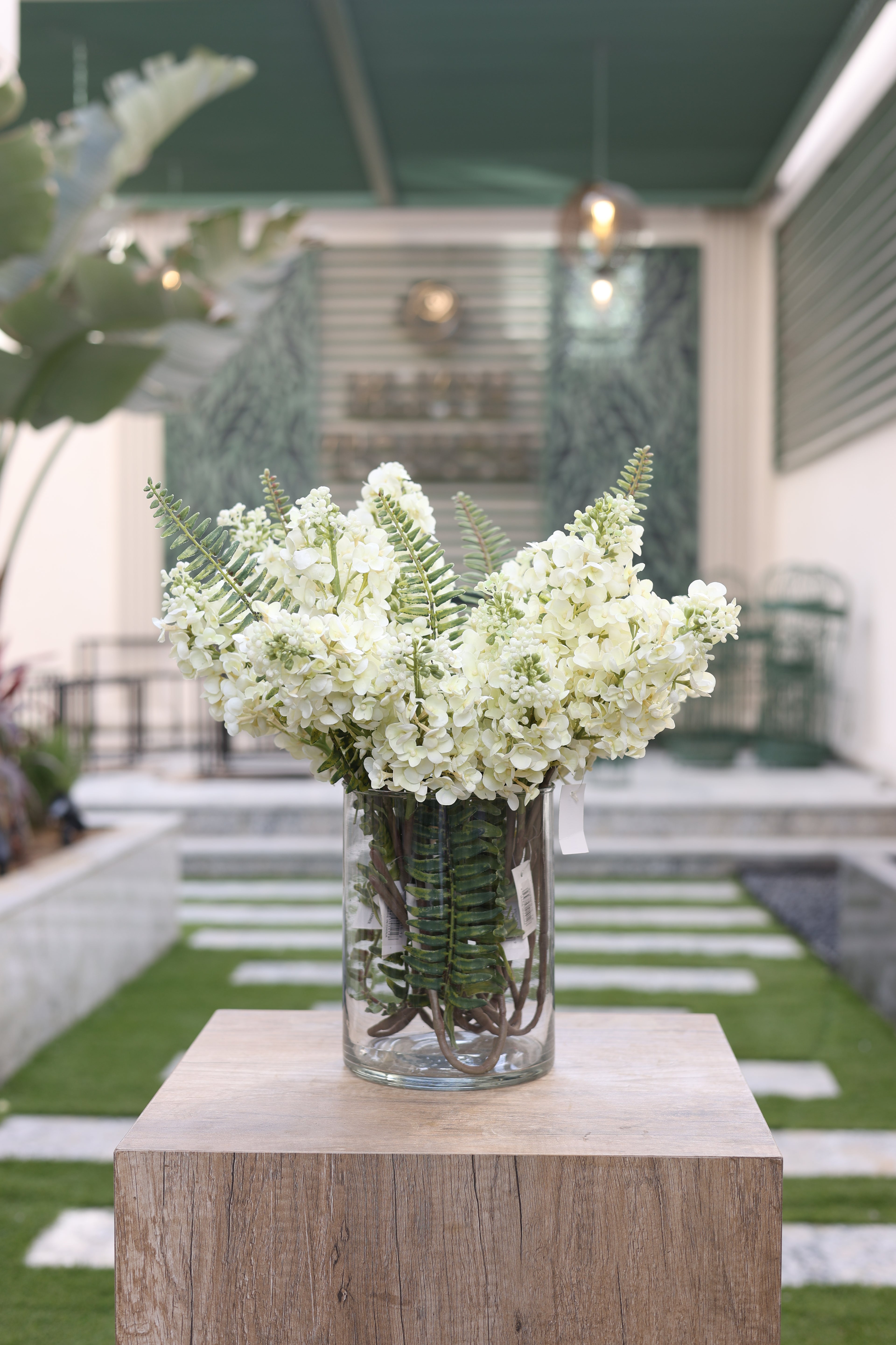 10 white artificial Anterina flowers in Lumaire glass vase Egypt