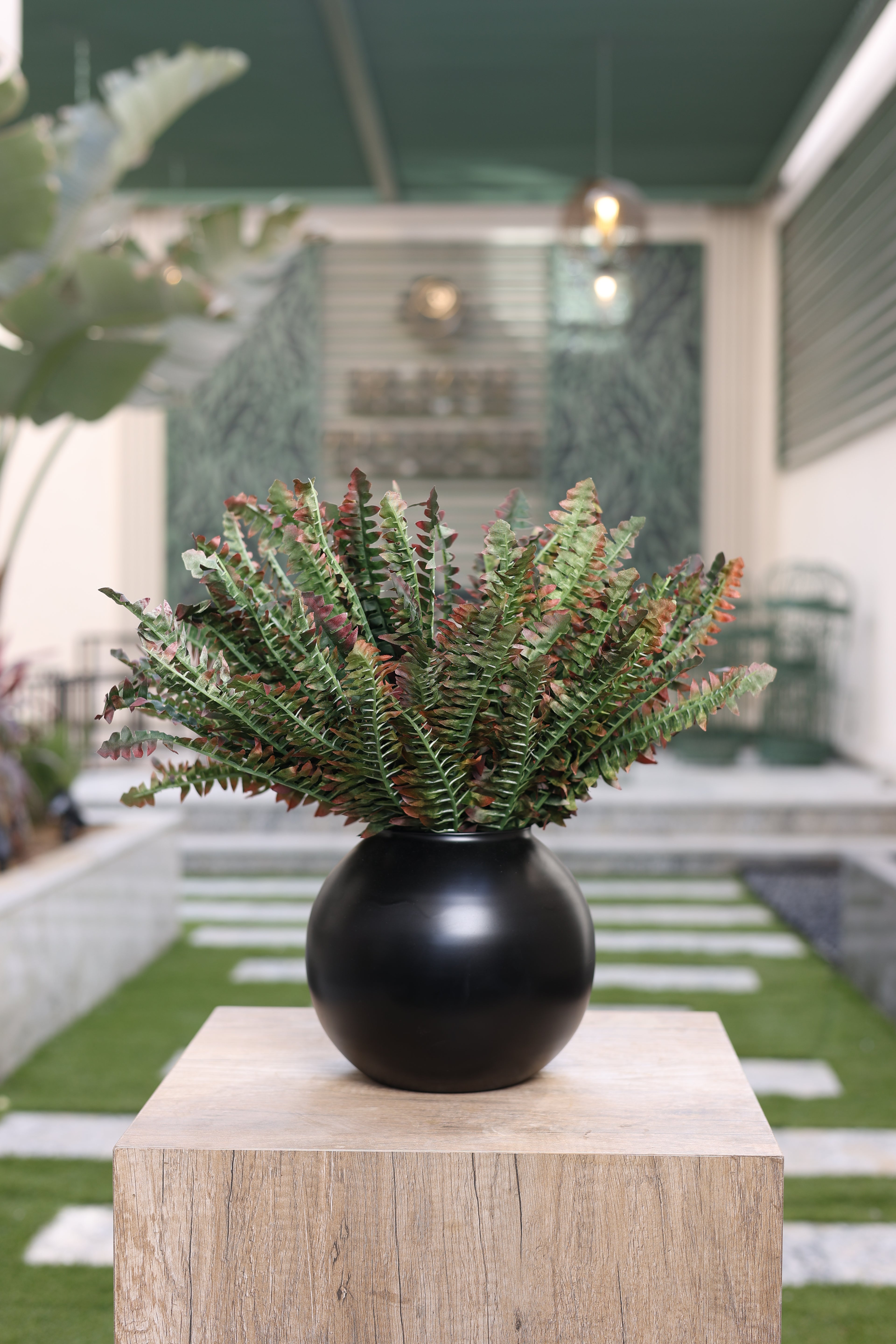 artificial fougère arrangement in round black vase Egypt