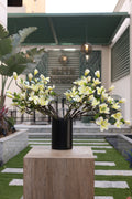 artificial magnolia flowers in black vase Egypt