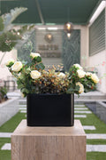 white artificial roses in glass vase Egypt