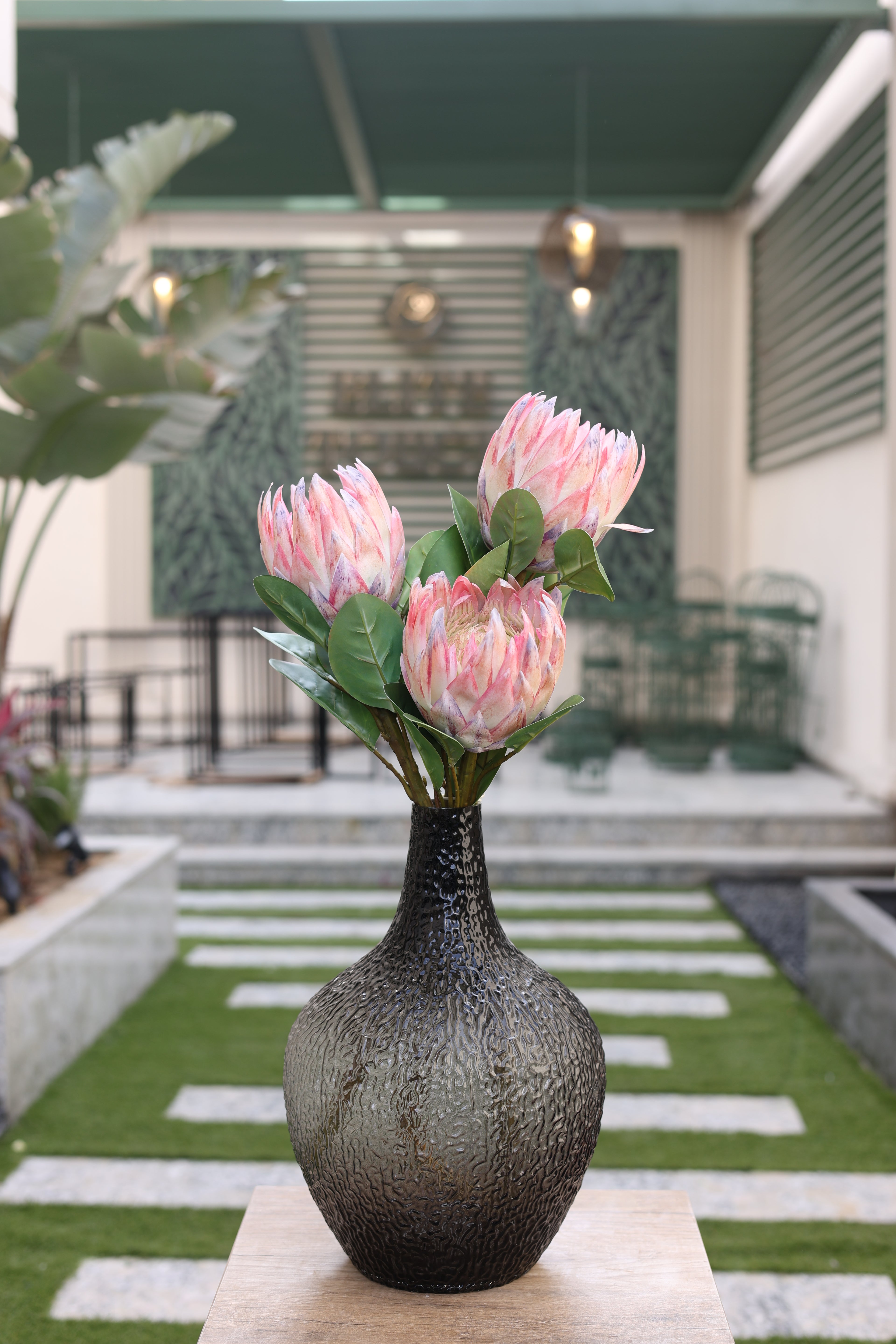 pink artificial Poritia flowers in glass vase Egypt