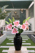 pink artificial lilies 5 stem in glass vase Egypt