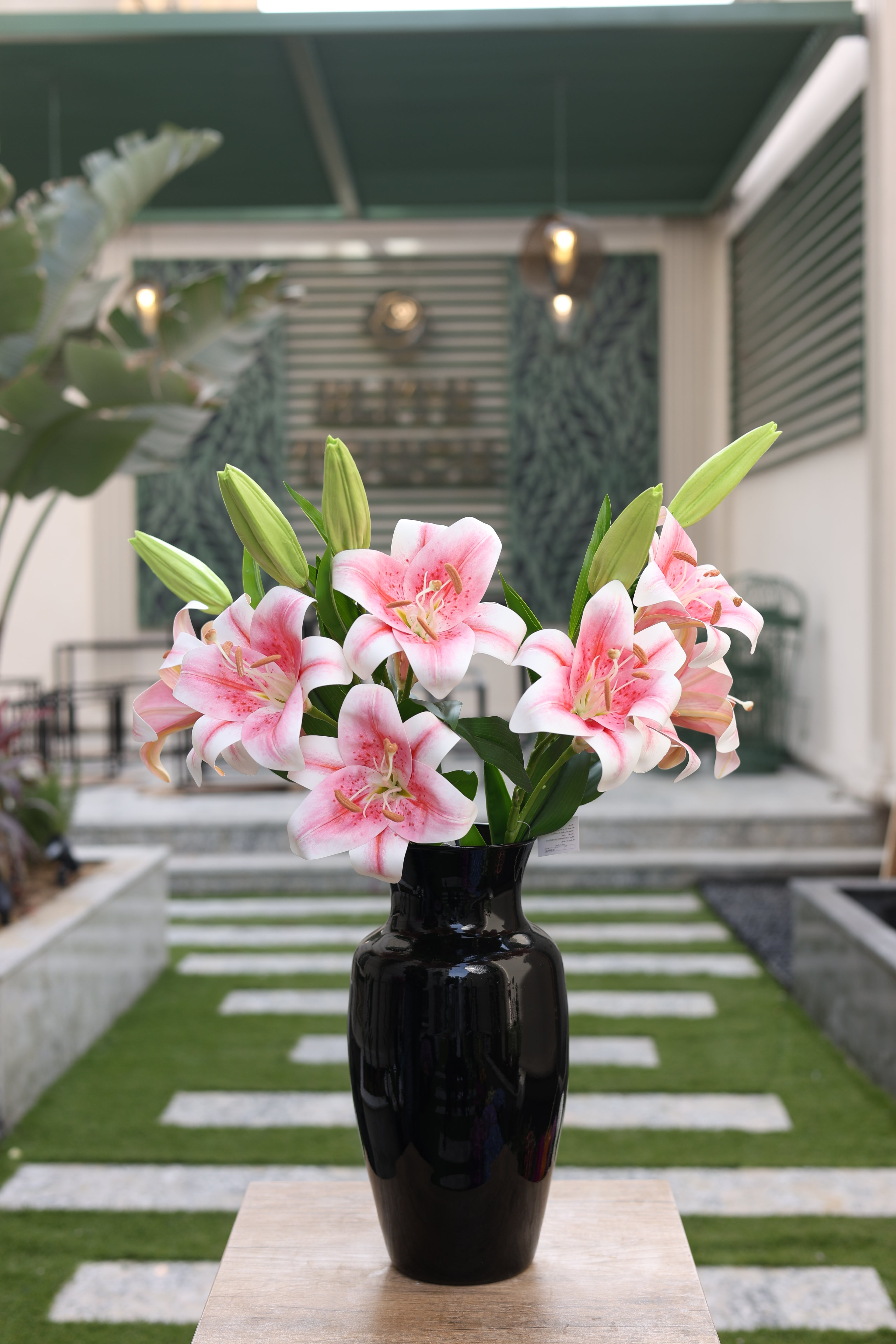 pink artificial lilies 5 stem in glass vase Egypt