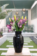 purple artificial lilies 5 stem in glass vase Egypt