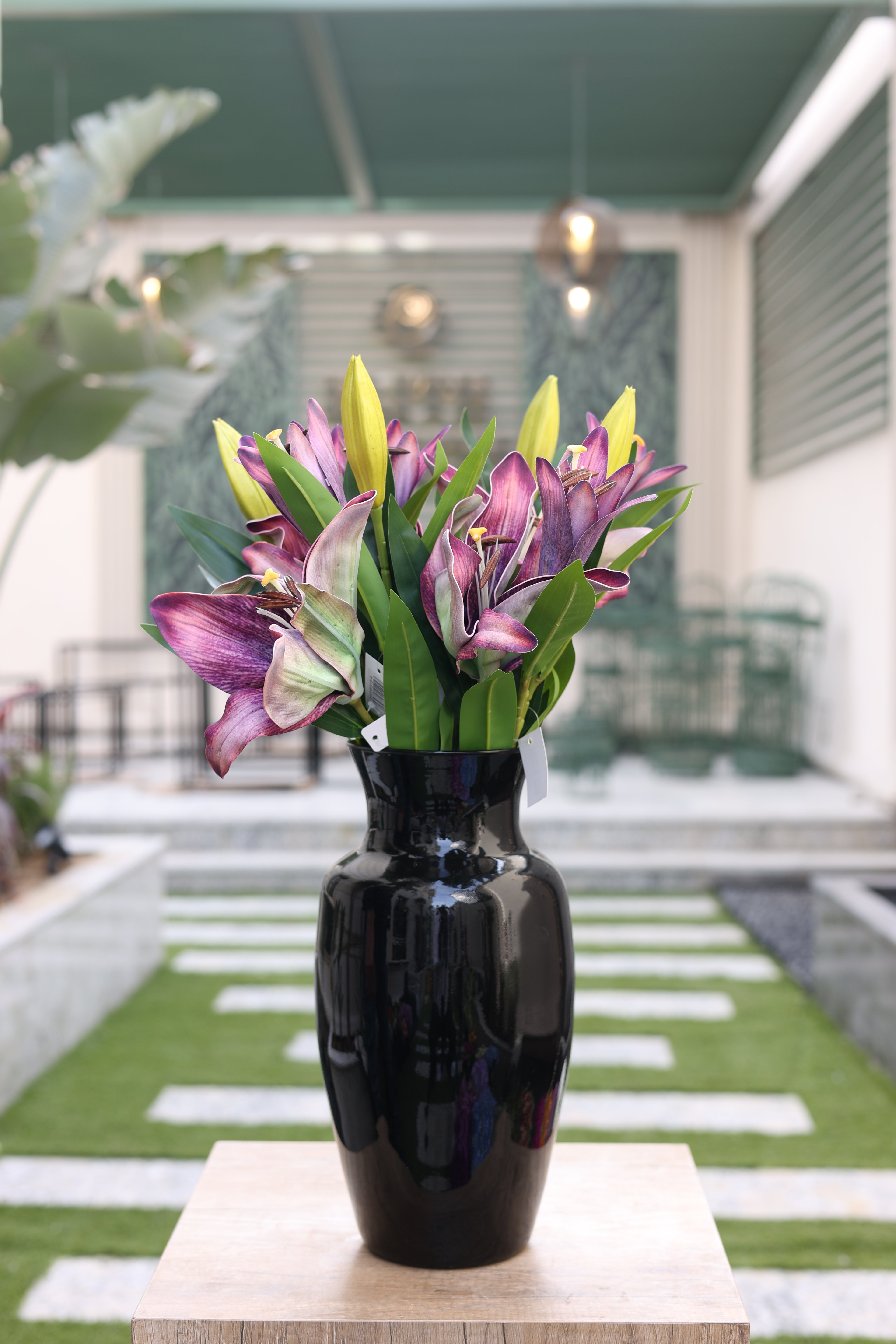 purple artificial lilies 5 stem in glass vase Egypt