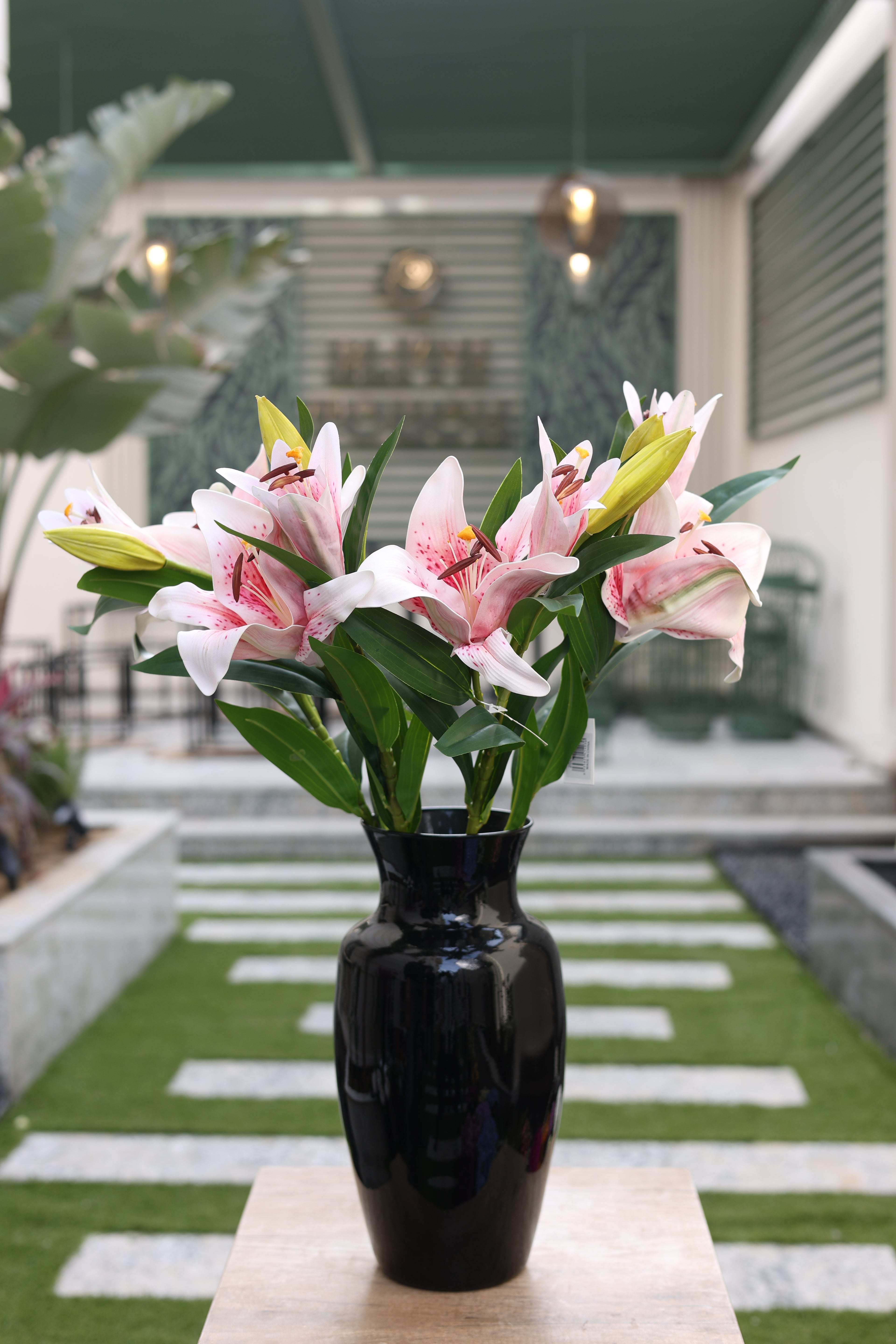 pink artificial lilies 5 stem in glass vase Egypt