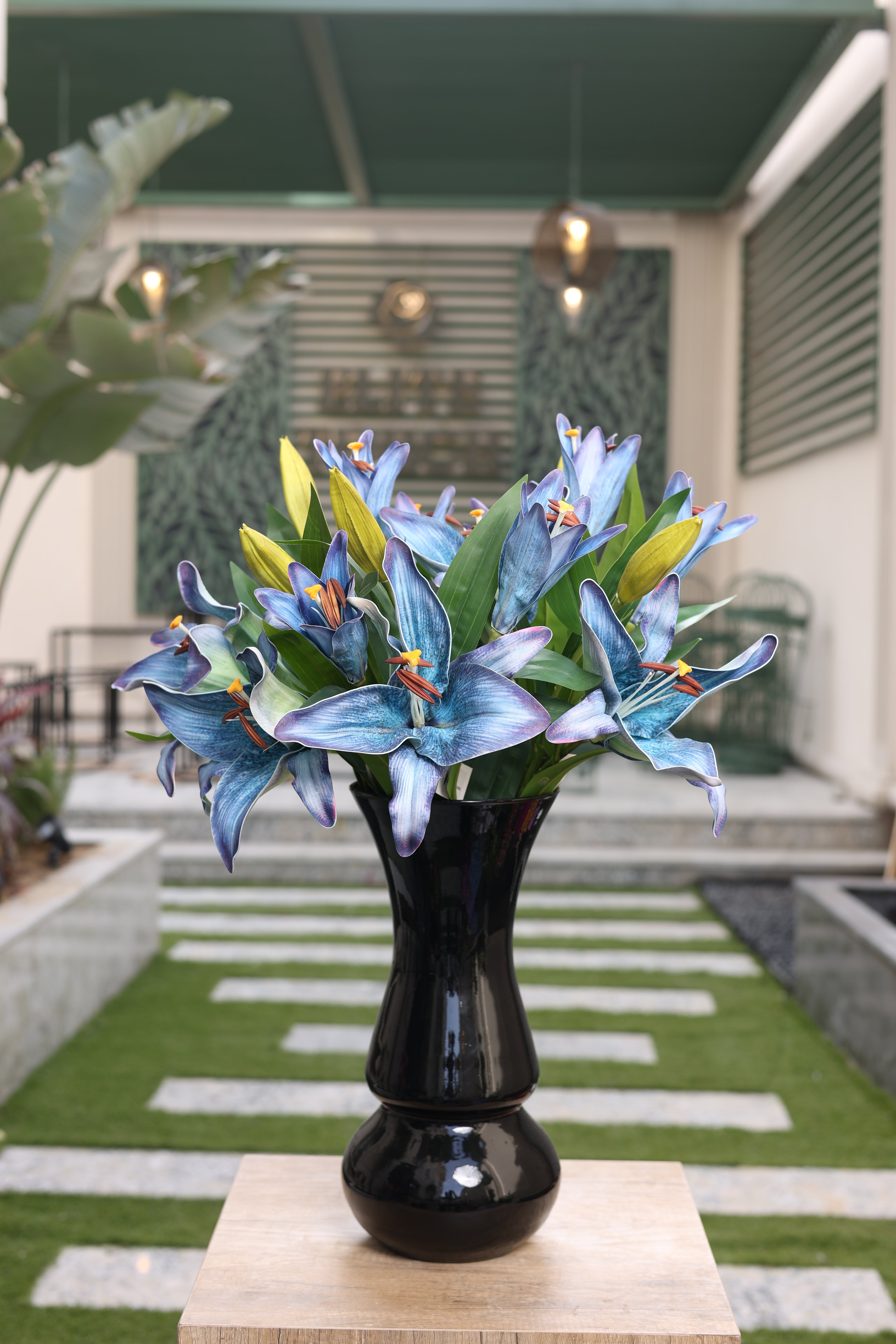 blue purple artificial lilies 6 stem in glass vase Egypt