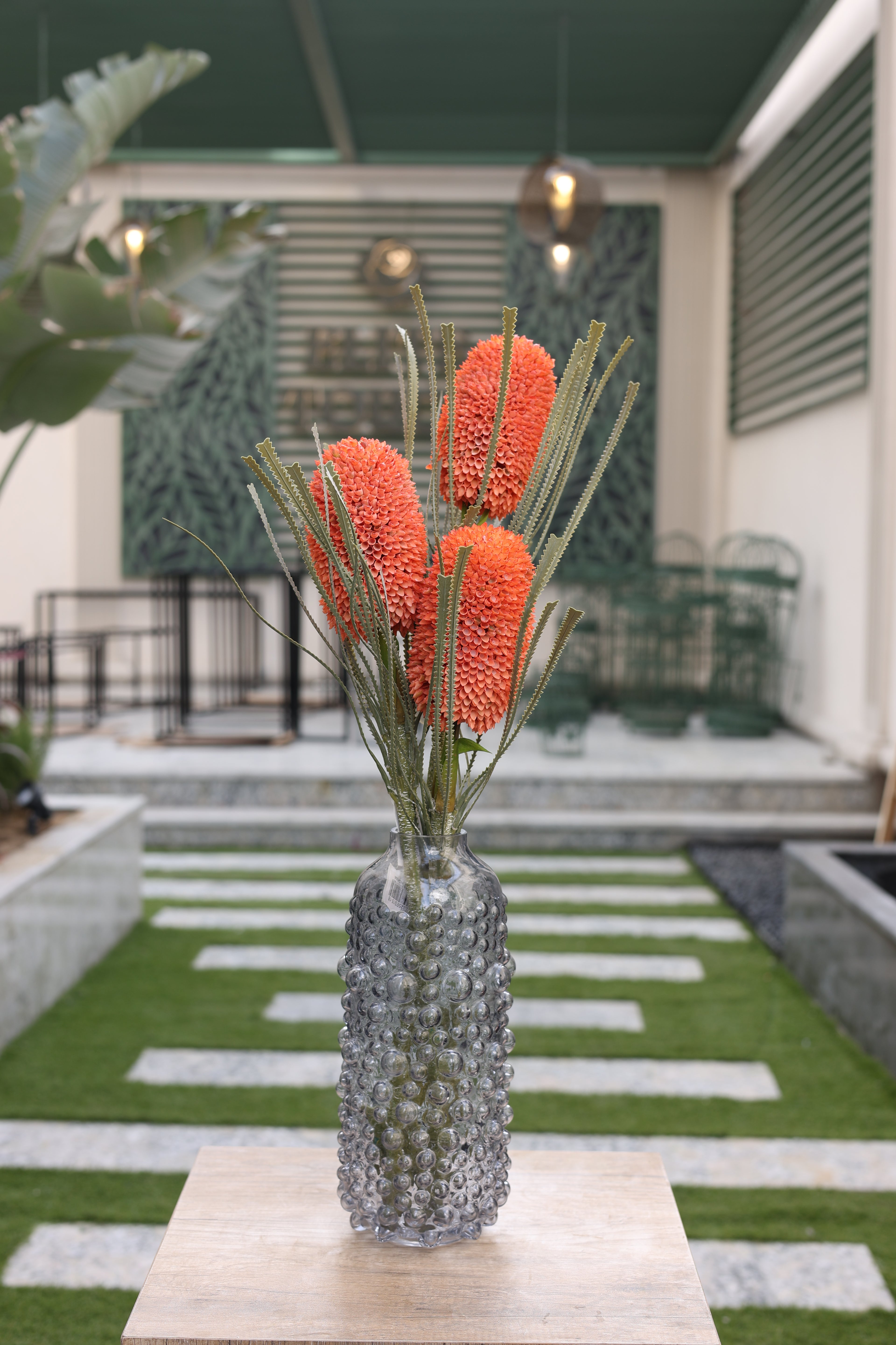 orange artificial Banksia 3 stem in glass vase Egypt