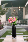 pink artificial tulips 7 stem in glass vase Egypt