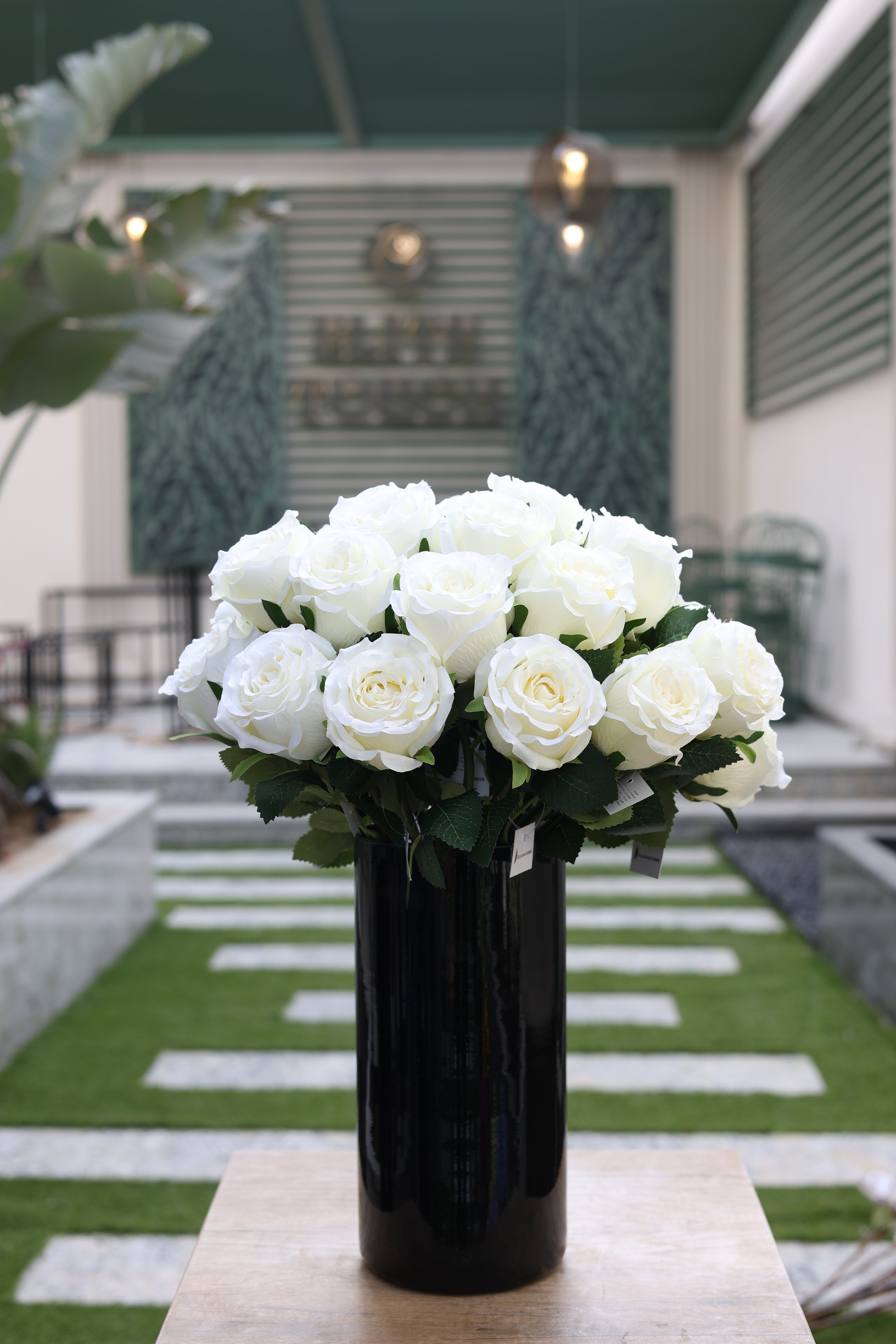 white artificial roses 20 stem in glass vase Egypt