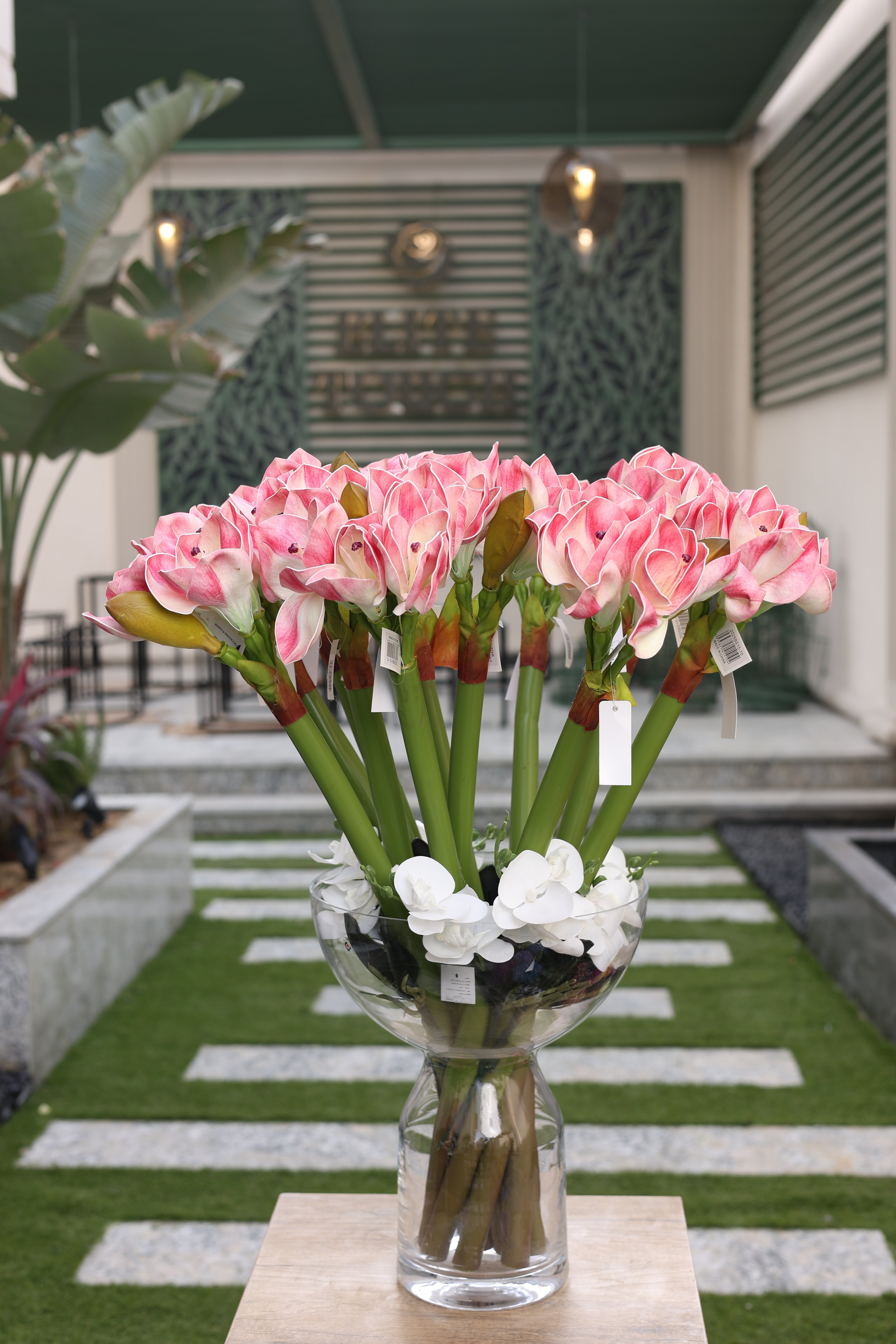 white pink artificial amaryllis 10 stem in glass vase Egypt