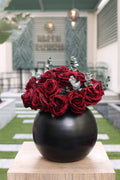 red artificial roses 16 stem in circular black vase Egypt