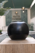 large minimalist circular black vase Egypt