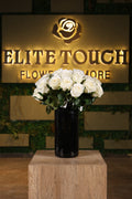 white artificial flowers in glass vase Egypt