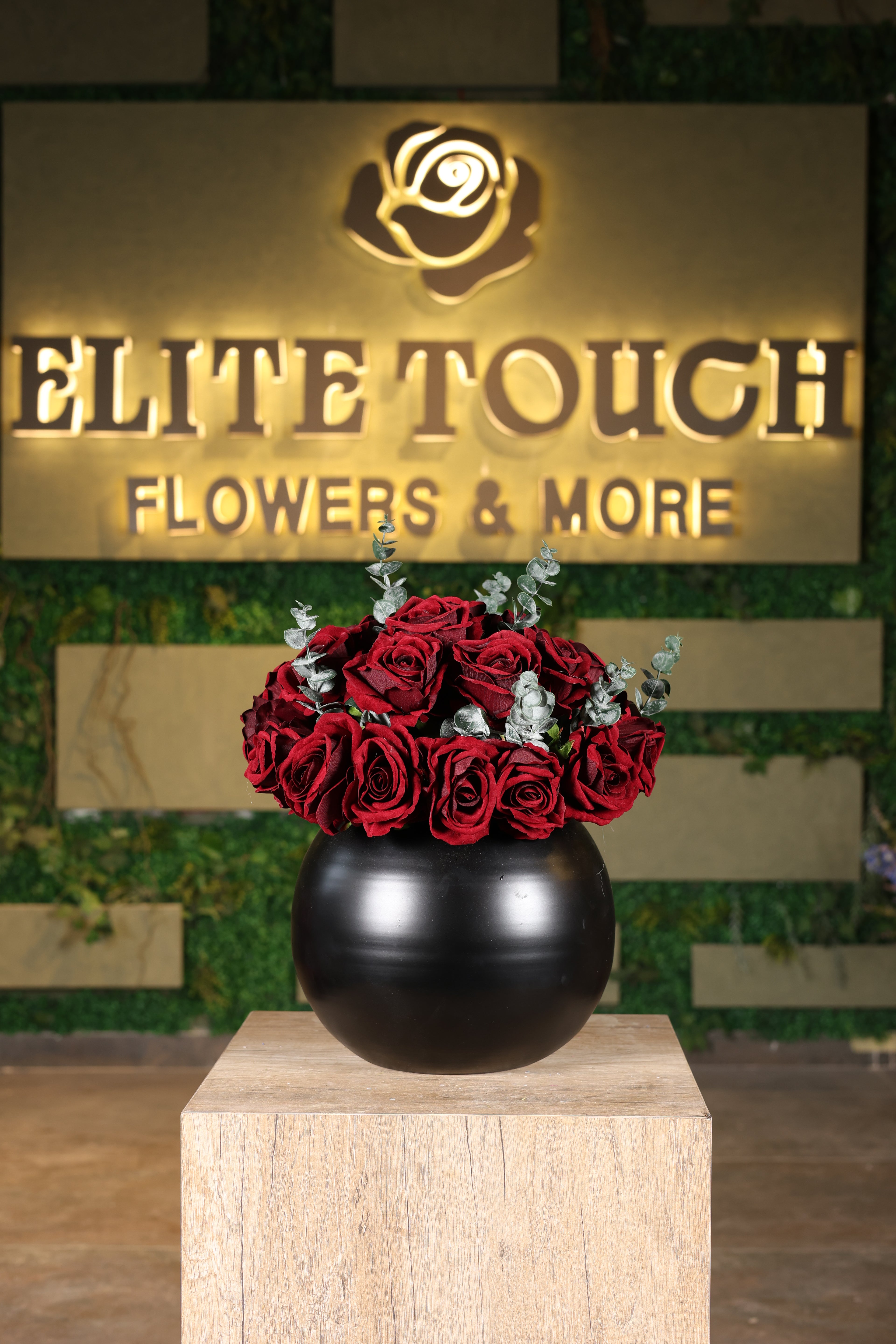 red artificial flowers in glass vase Egypt