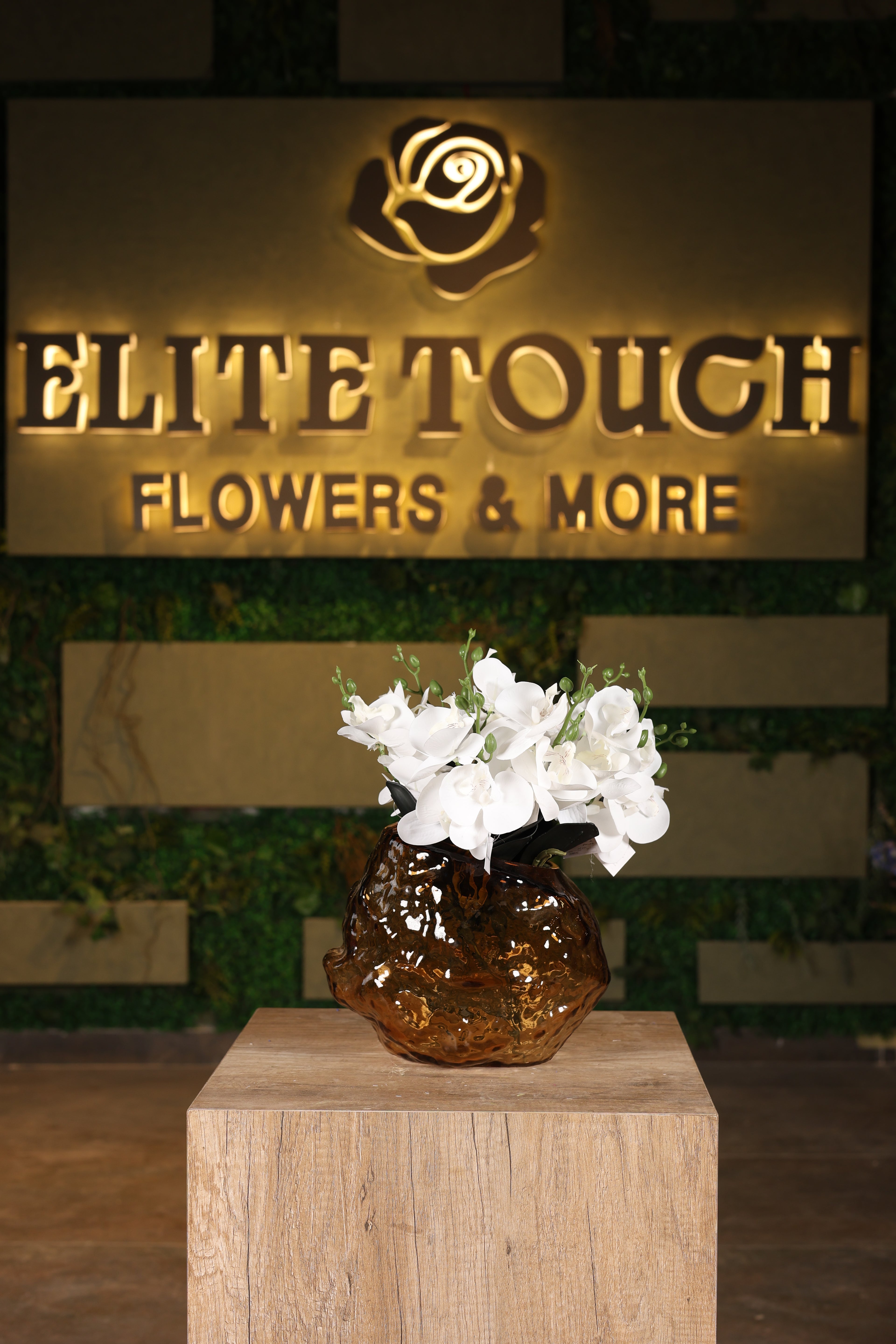 artificial orchid blooms in glass vase Egypt