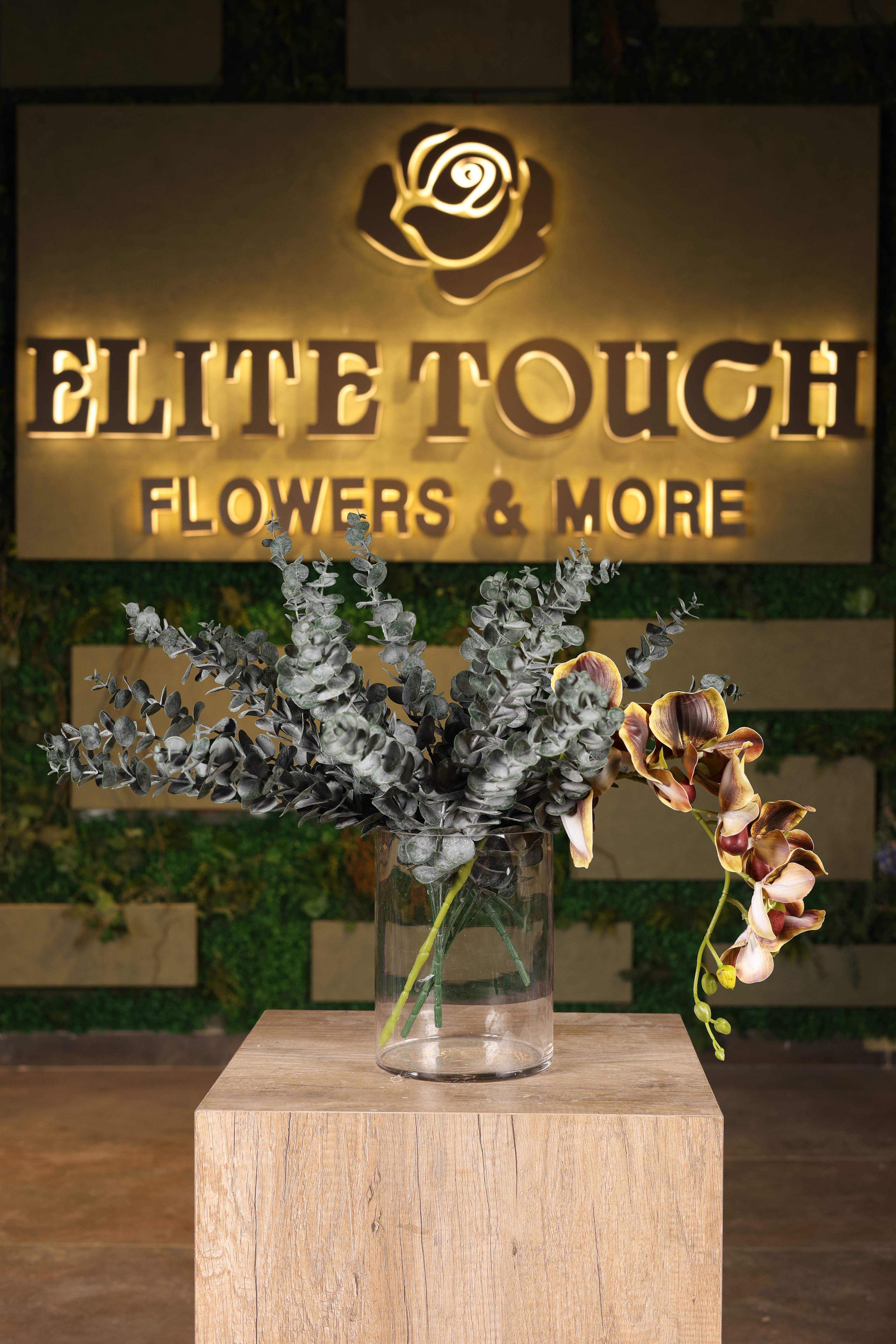 dense artificial green foliage in glass vase Egypt