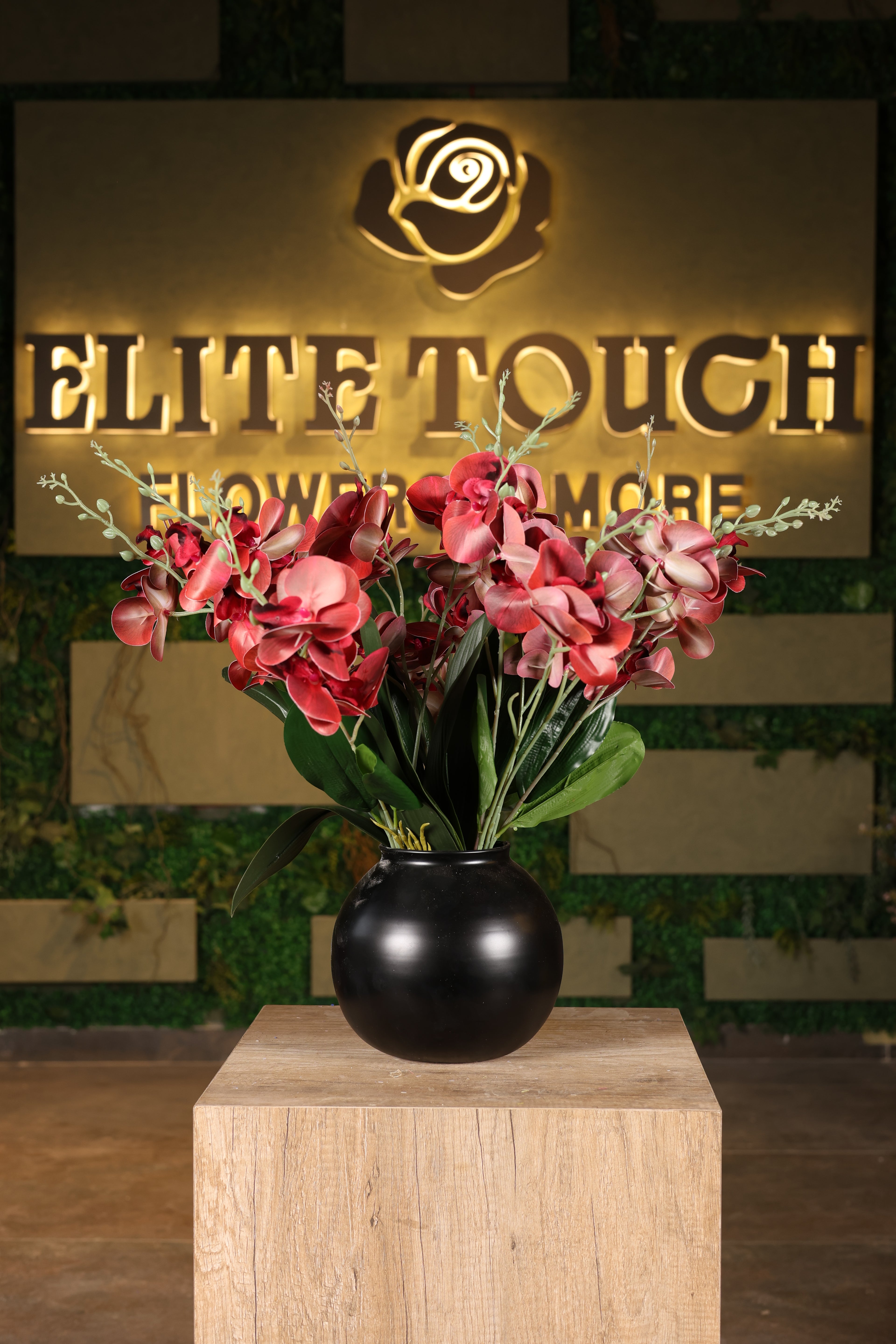 premium artificial orchid in glass vase Egypt
Image Description	Premium artificial orchid arrangement in a clear glass