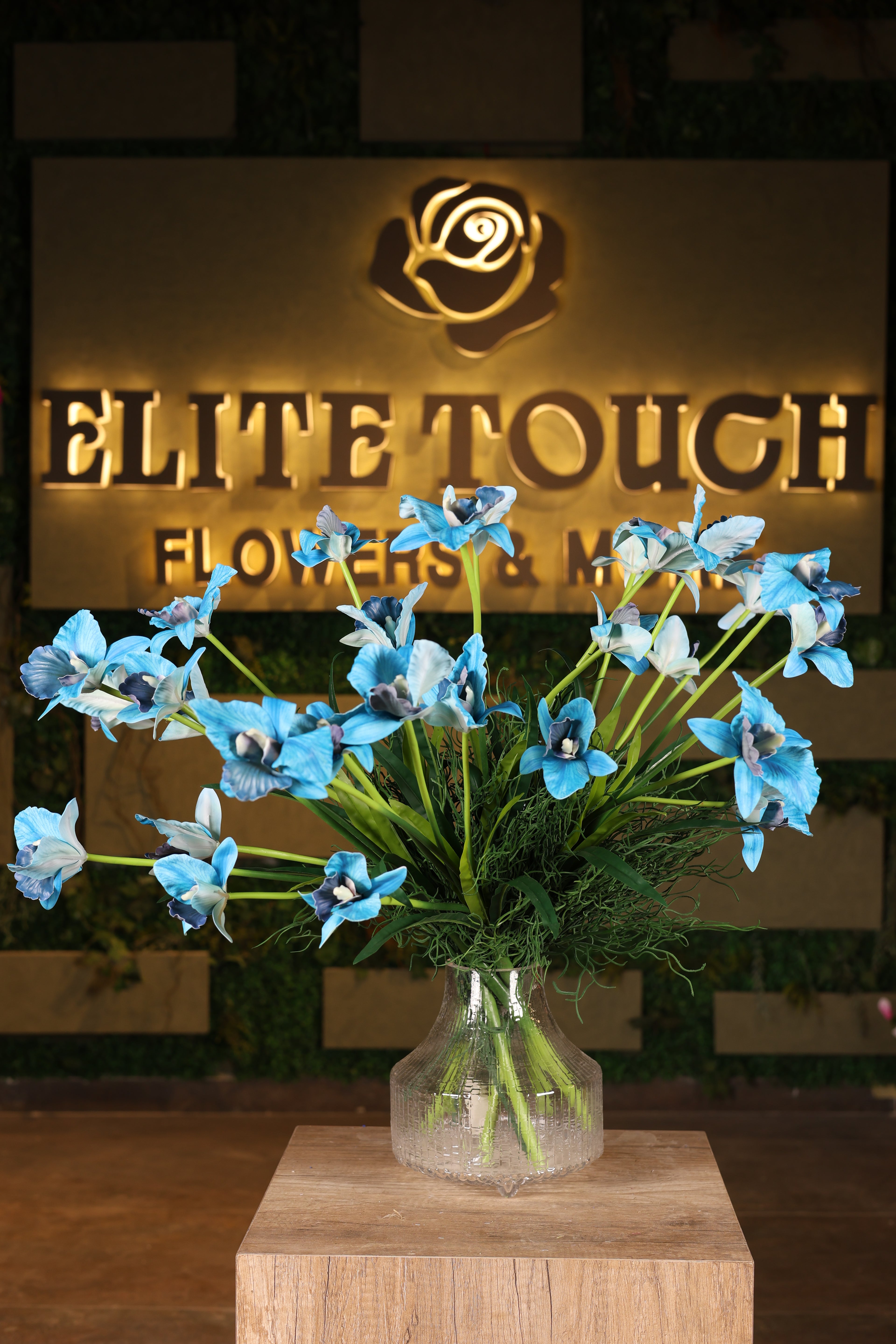 tall artificial baby orchid in glass vase Egypt