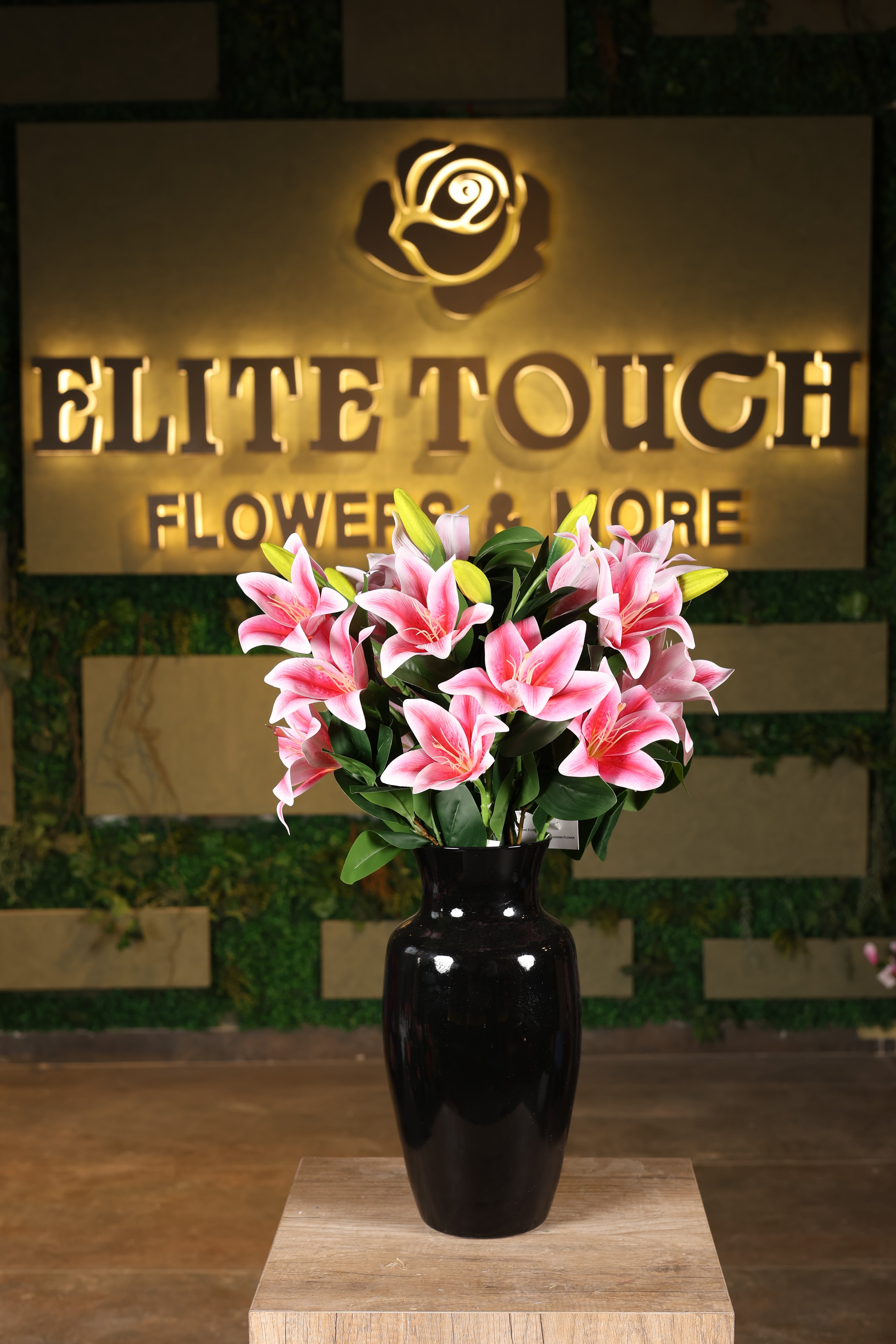 medium artificial lilies in glass vase Egypt