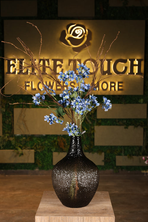artificial Alstroemeria and dried flower in glass vase Egypt