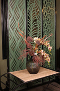 artificial orchid green foliage dried flower in glass vase Egypt