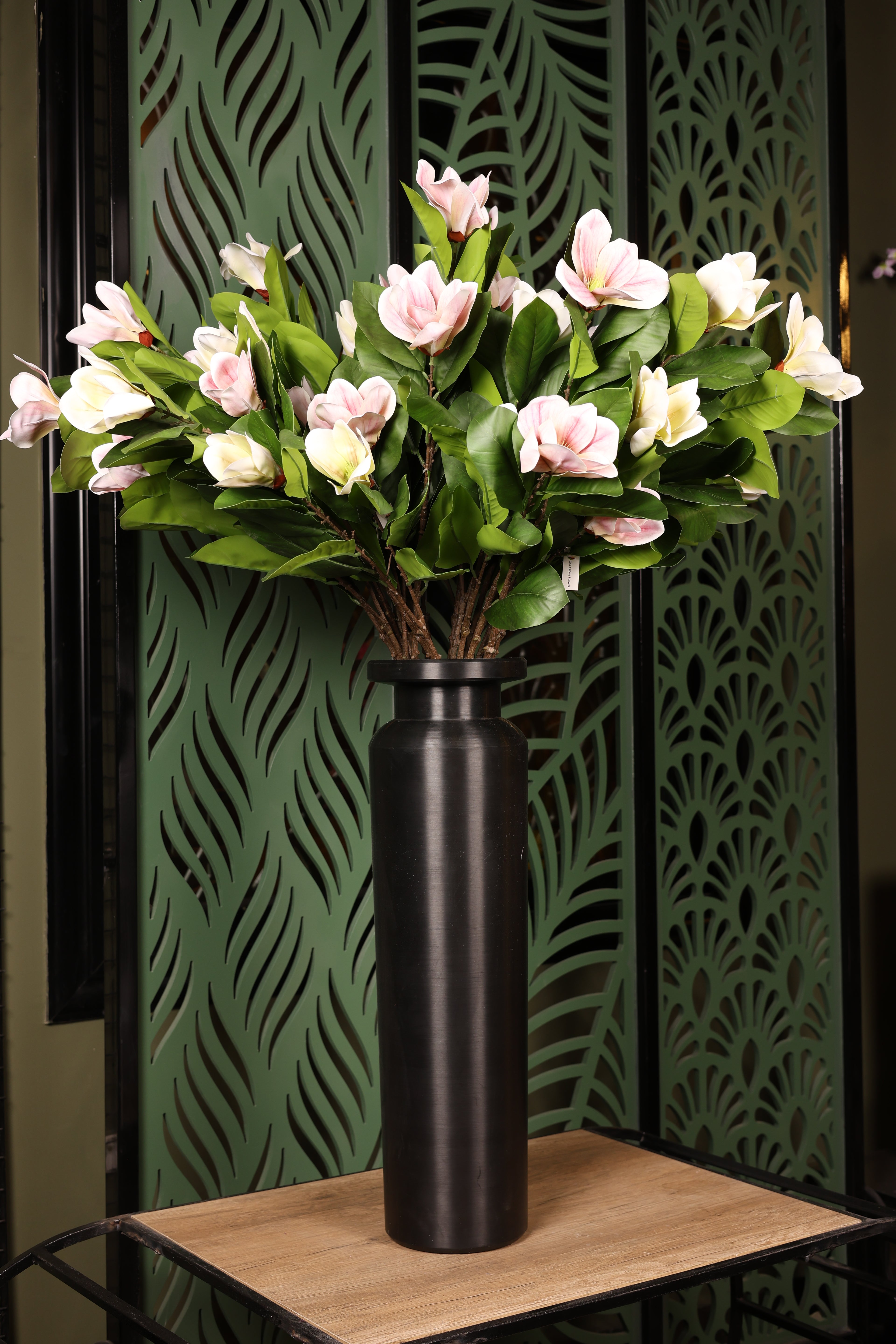 elegant artificial magnolia in glass vase Egypt