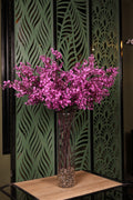 small artificial magnolia in glass vase Egypt