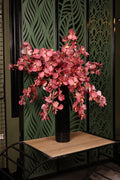 deluxe artificial orchid and green foliage in glass vase Egypt