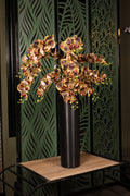 artificial orchid and dried flower in glass vase Egypt
