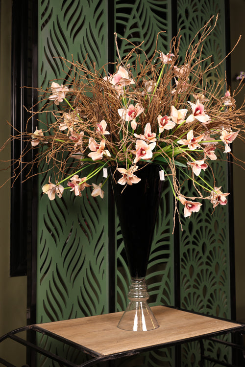 grand artificial baby orchid and dried flower in glass vase Egypt