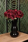 medium mixed artificial flowers in glass vase Egypt