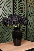 small plus mixed artificial flowers in glass vase Egypt