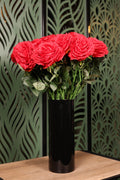 medium plus mixed artificial flowers in glass vase Egypt