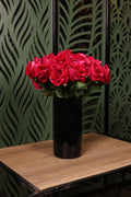 balanced mixed artificial flowers in glass vase Egypt