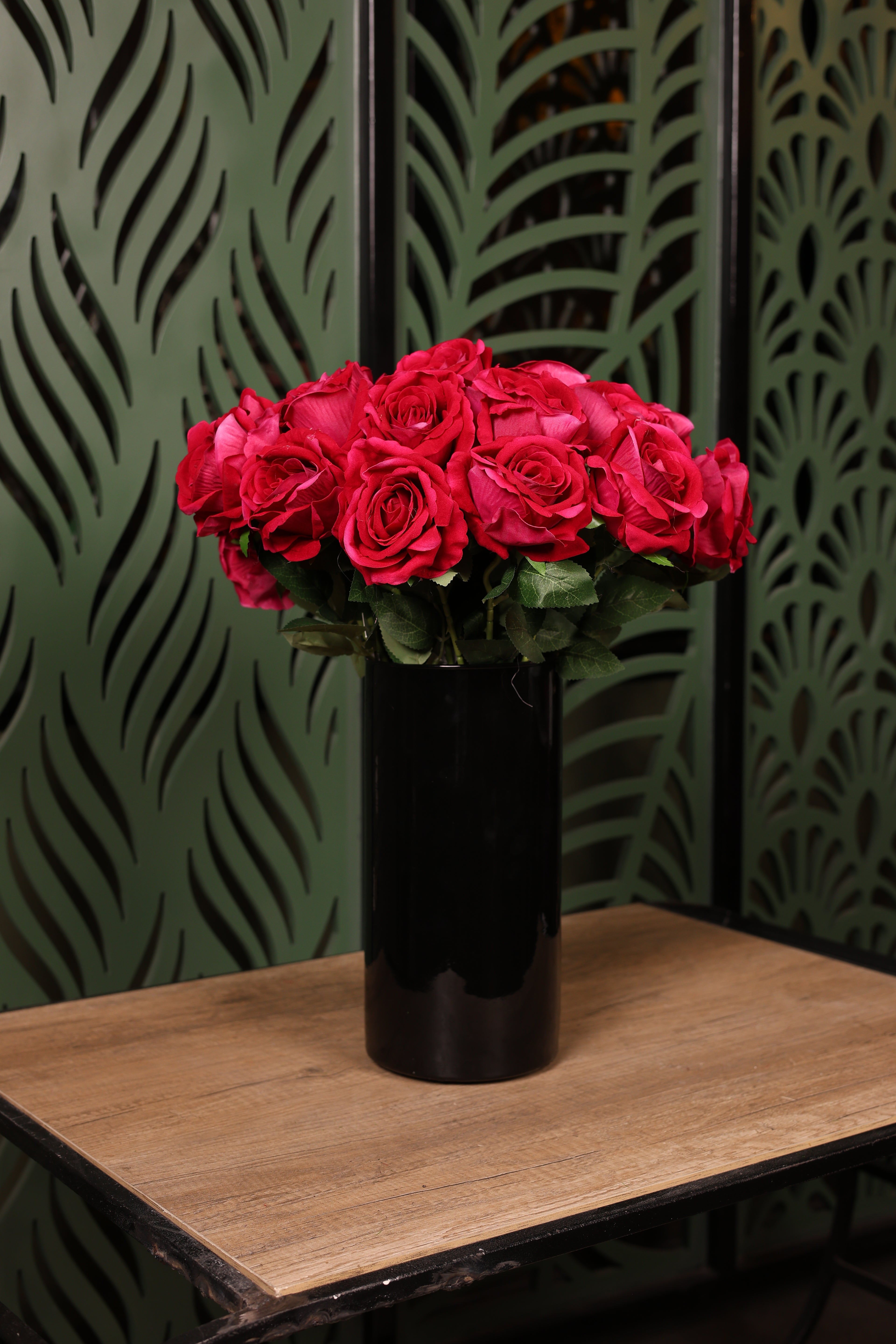 balanced mixed artificial flowers in glass vase Egypt