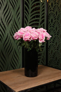 standard mixed artificial flowers in glass vase Egypt