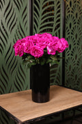 essential mixed artificial flowers in glass vase Egypt
